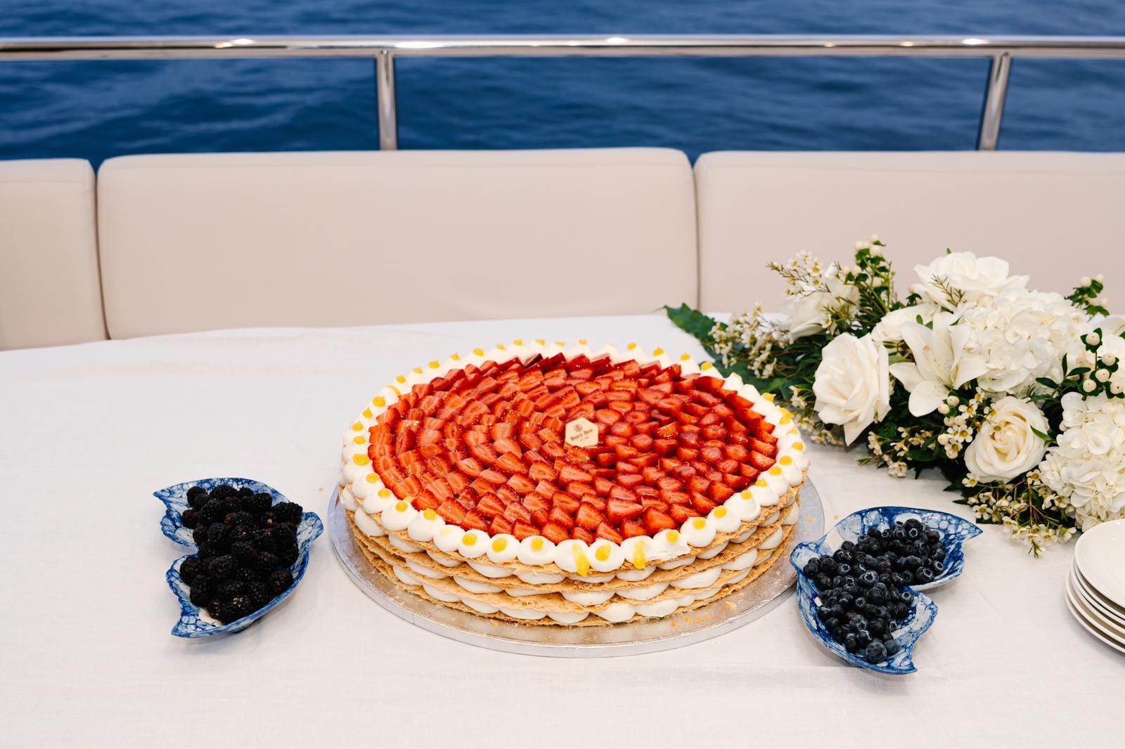 Birthday cake set up on the bow of a yacht in Malta