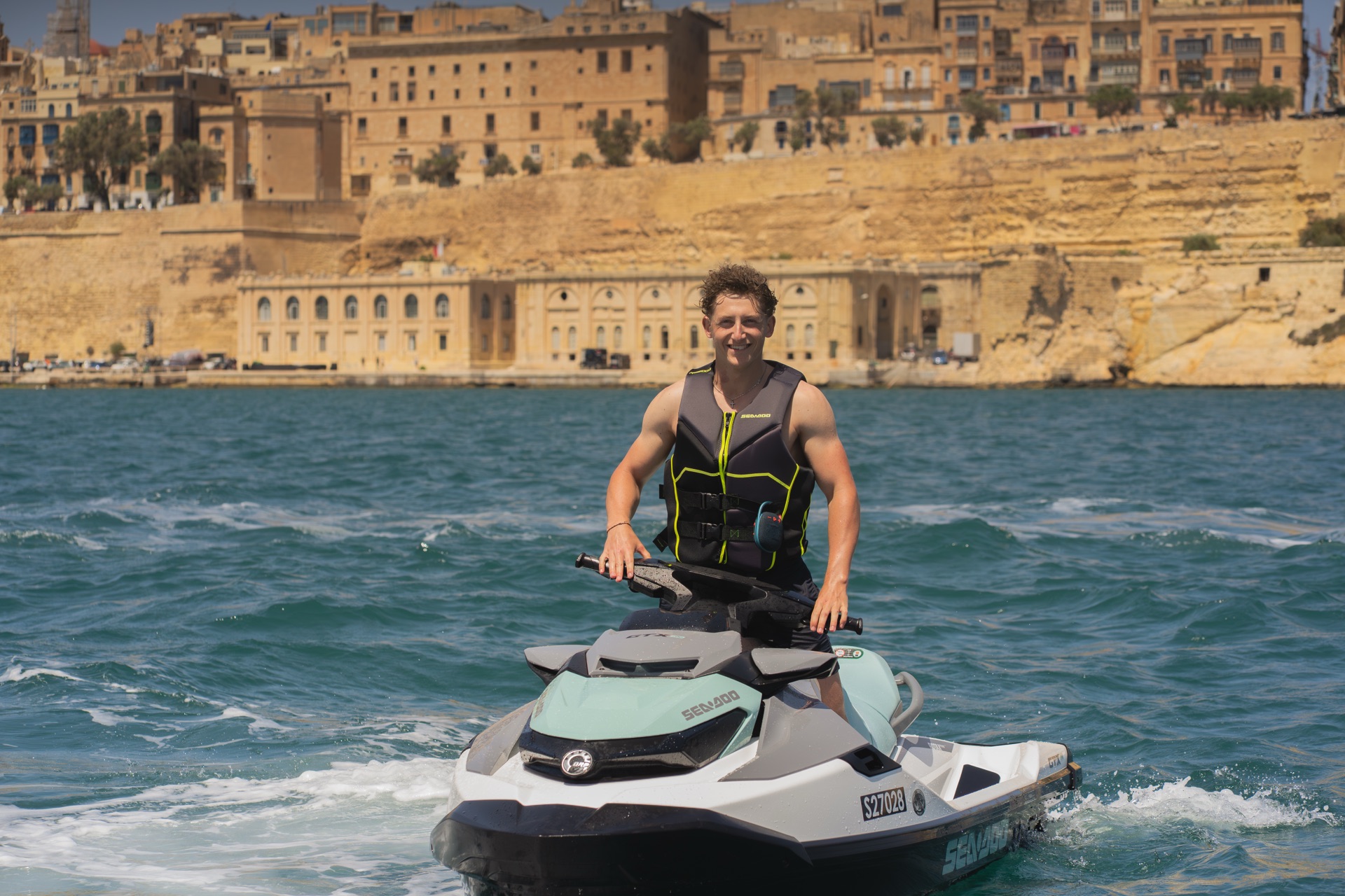 Jet ski running below the Valletta bastions