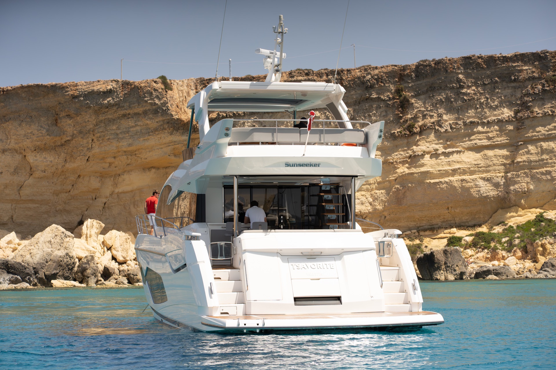 Yacht stern anchored at a Maltese cove