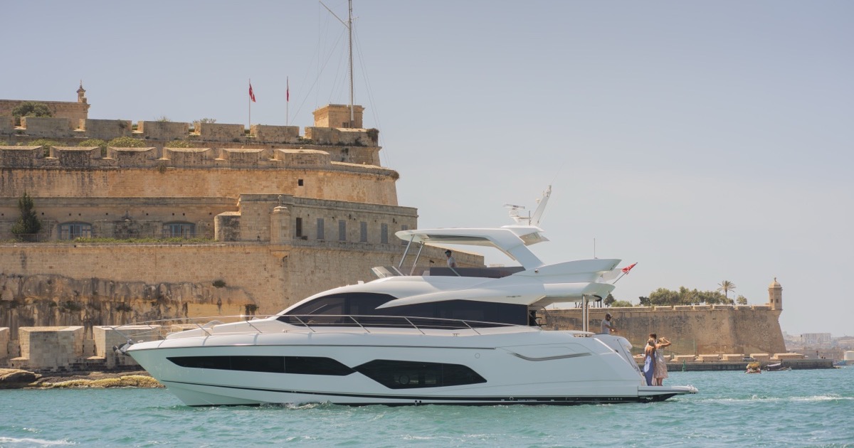 Yacht near the Valletta bastions at sunset